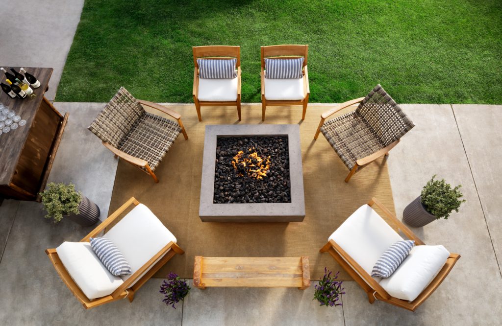 Chairs around fire pit at The Sanctuary Beach Resort in Monterey Bay