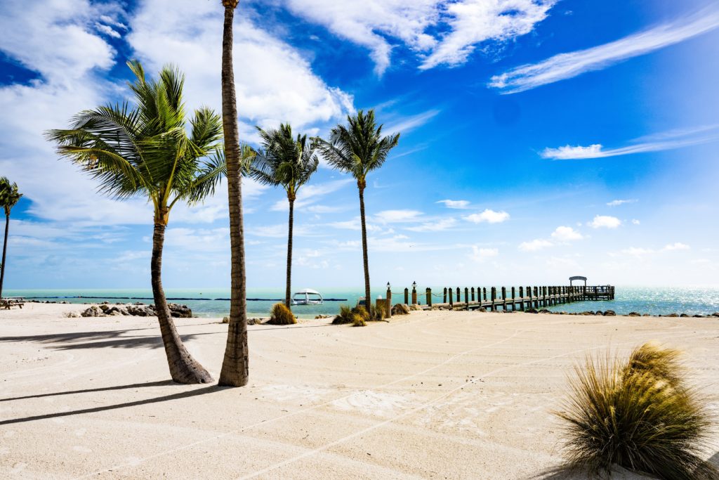 Beach leading to fishing pier at Islander Resort in Islamorada